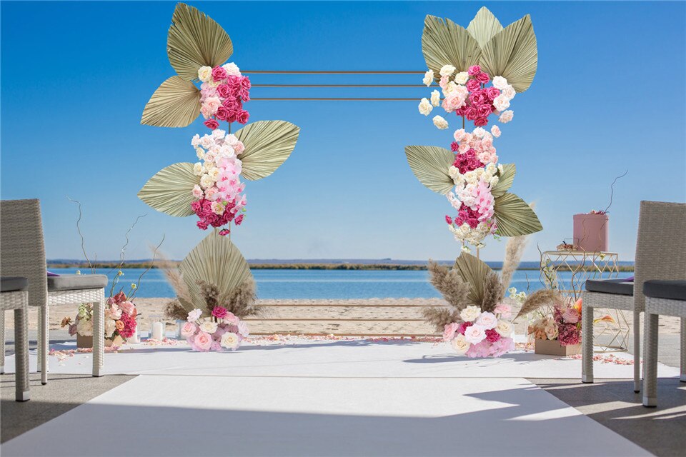 white garland backdrop for wedding